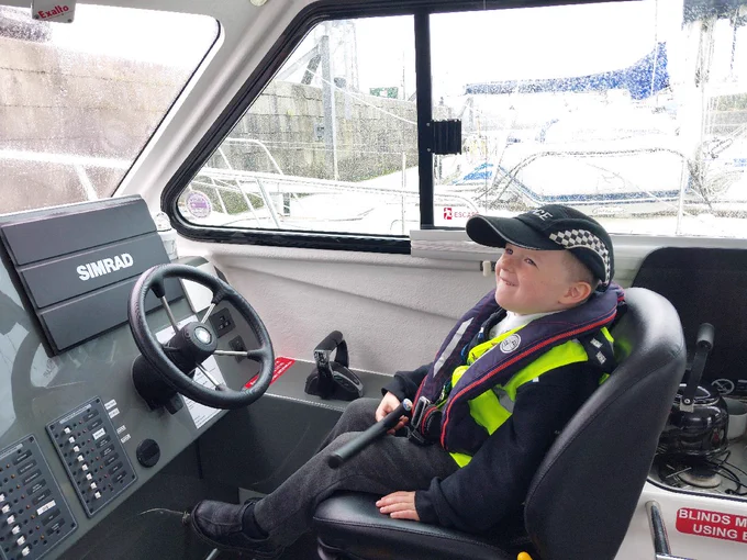 Young person within police vehicle