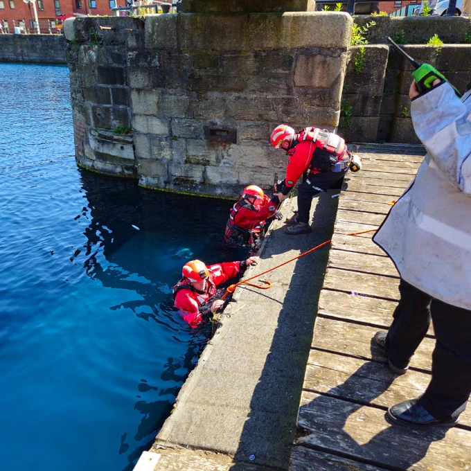Firefighters getting out of the water  