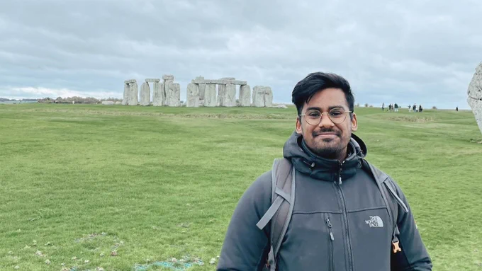 Keshlan Padayachee standing in front of Stonehenge.