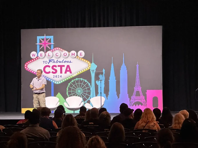 Stefik presenting on stage at CSTA 2024