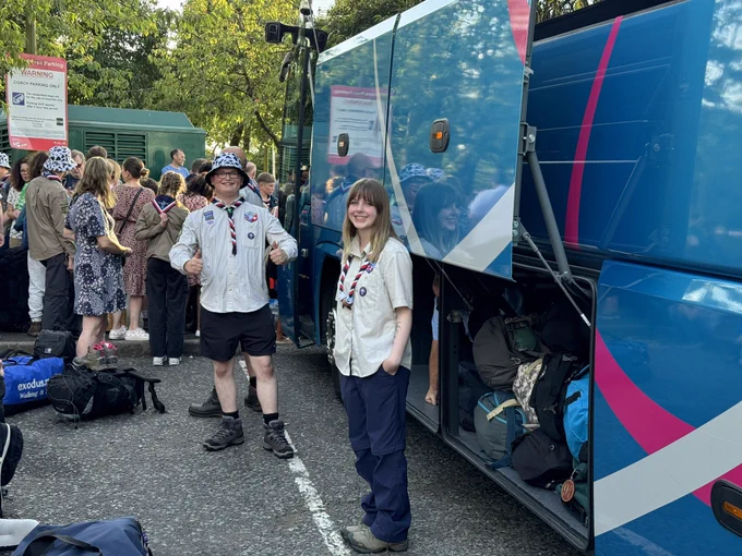 Two 7th Bromsgrove Scout Leaders loading kit into a coach