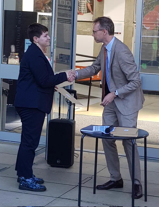 Ash Adnitt receiving from Head of the Biological Sciences Department James McEvoy the Contribution to Biosciences Prize 