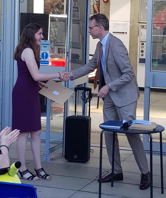 Kate Calliss receiving from Head of Department James McEvoy the Paxton Prize to the best graduand in Biological Sciences at Royal Holloway University London