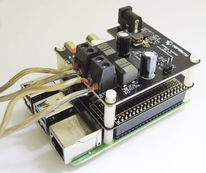 The AAmp60 requires a compatible HiFiBerry sound card. Here, a DAC  ADC is plugged directly onto the GPIO ports at the bottom, with the AAmp60 sitting on top.