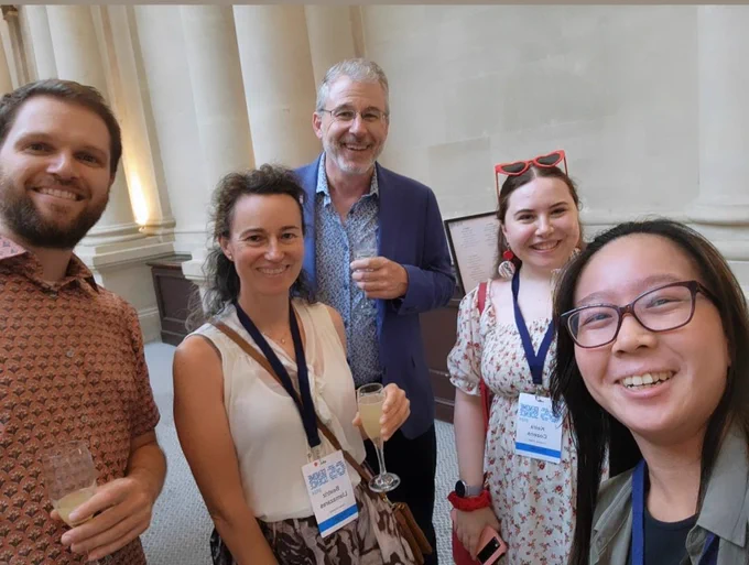 A picture of Keira and other academics at the conference drinks reception 