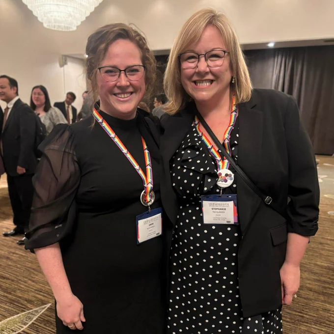 Drs. Erin McConnell and Stephanie MacQuarrie smiling for a photo at an awards ceremony.