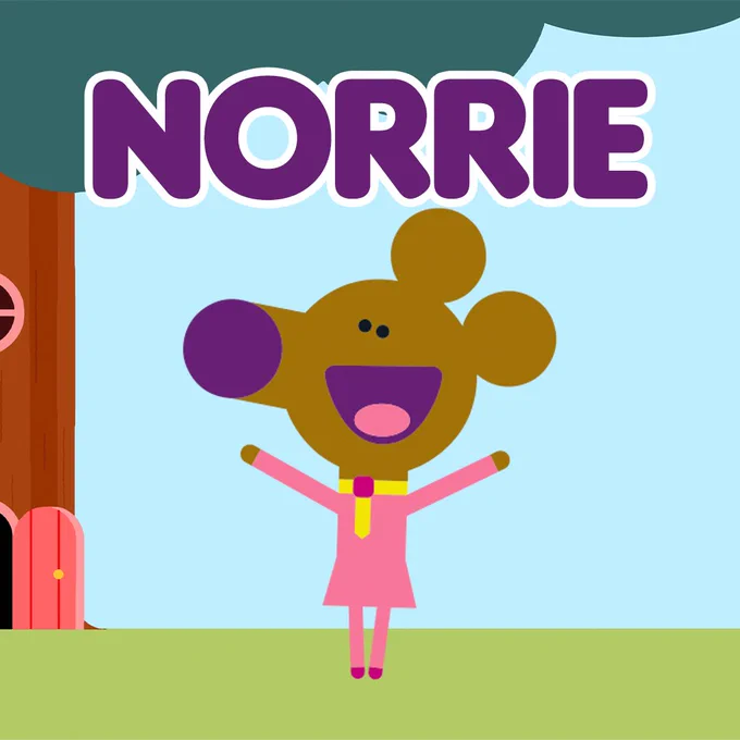 Norrie standing in front of her house with her name in bold purple above her head