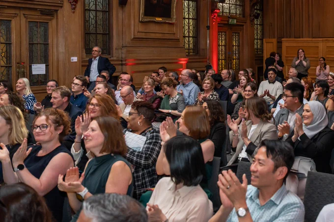 The audience cheering for a winner