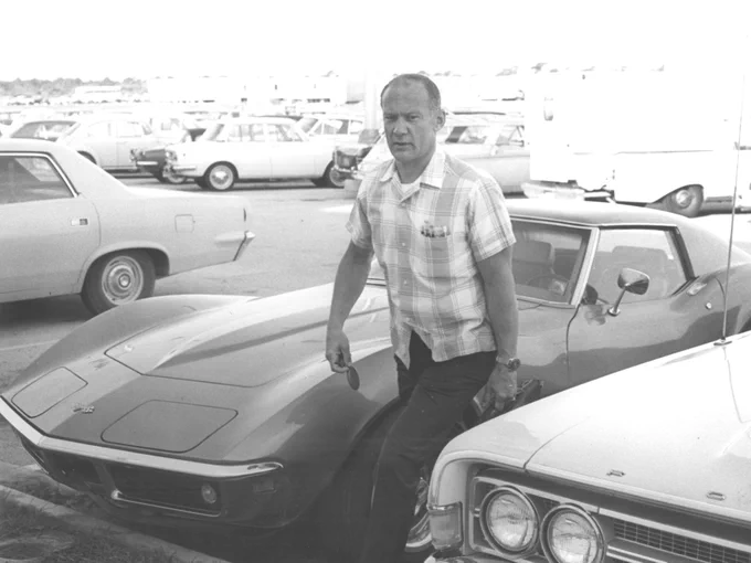 Apollo 11 Lunar Module Pilot Edwin (Buzz) Aldrin walks away from his parked Corvette Stingray as he arrives for work at Kennedy Space Center on July 9, 1969.