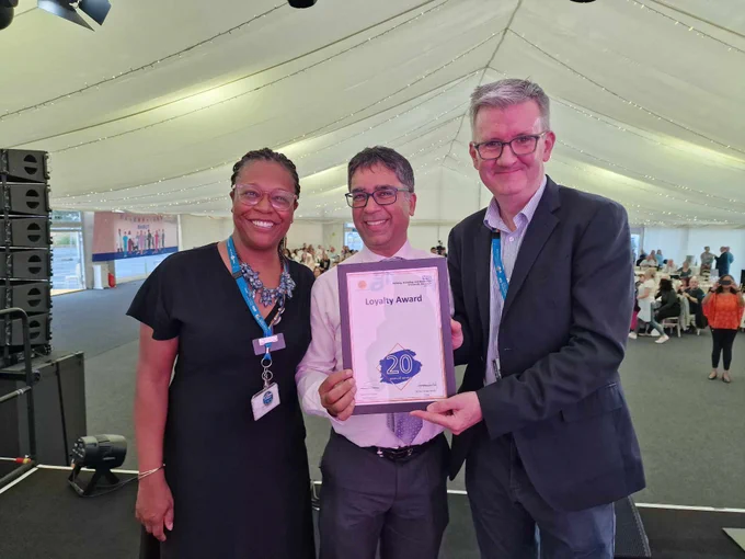 Matthew Trainer and Janine La Rosa giving certificate to member of staff