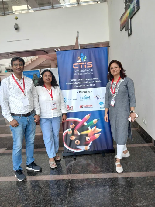 Our team standing with a CTiS2024 stand.
