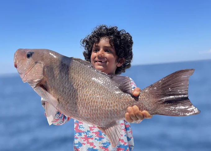 Youth proudly showing off their catch!