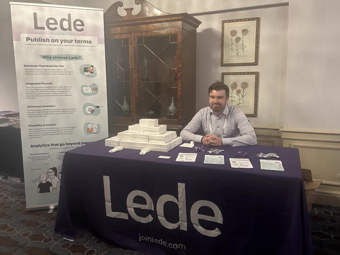 Lede CEO Matt Johnson sitting at Lede's AAN table, ready to chat about our integrated platform for independent publishers. 