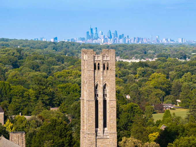 Clothier Tower from a drone with the Philadelphia skyline in the background.