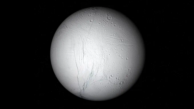Enceladus - a white moon with blue strips on a black background