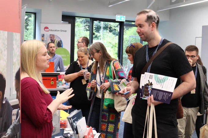 Delegates and exhibitors in the village