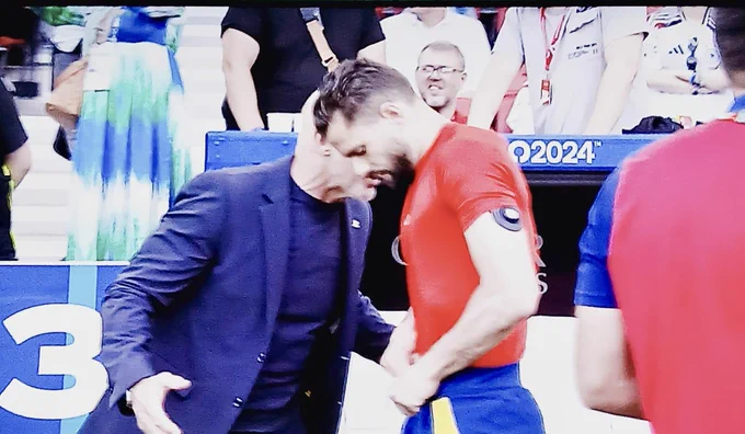 José Ignacio Fernández Iglesias aka Nacho, wearing a glucose sensor and speaking to his manager at the Euros 2024.