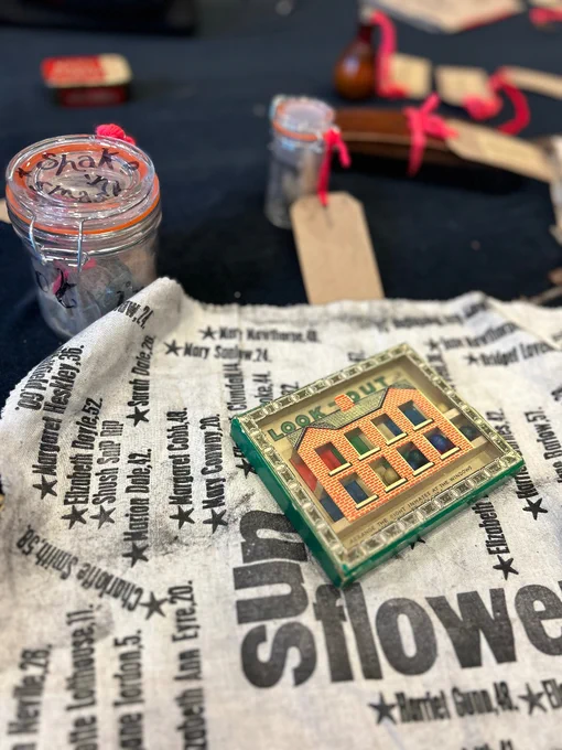 An old fashioned game wrapped in a letter press printed price of fabric.