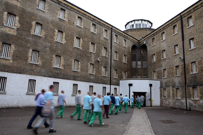 Prisoners return from their jobs to their wings for lunch at Wandsworth prison. HMP Wandsworth in South West London was built in 1851 and is one of the largest prisons in Western Europe. It has a capacity of 1456 prisoners. Photo by Andy Aitchison.