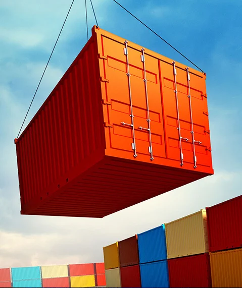 image of a shipping container being loaded onto a dock stacked with containers