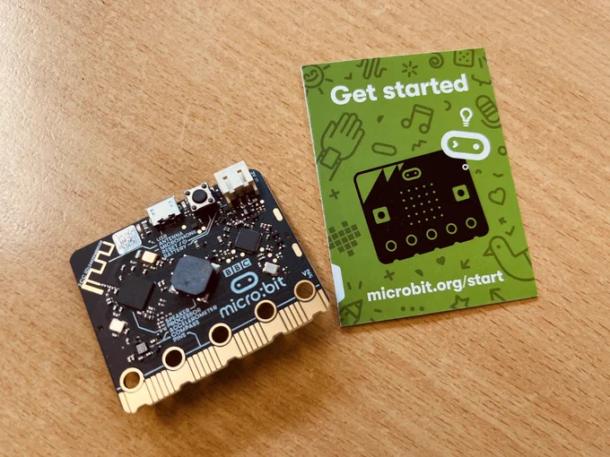A micro:bit and its "Get started" leaflet.
