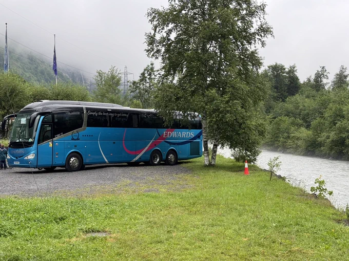 Coach parked by the River Kander