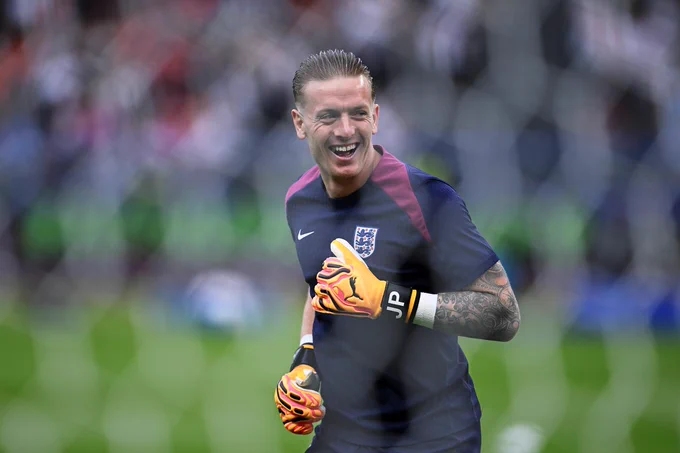 Jordan Pickford smiles during the warm-up