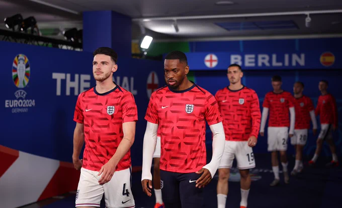 Declan Rice and Ivan Toney walk out of the tunnel.
