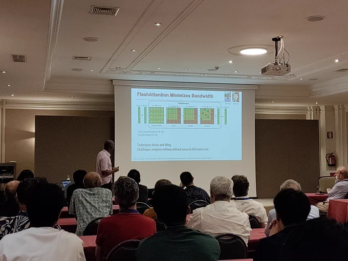 Kunle Olukotun giving keynote talk in front of slide at #ACACES24