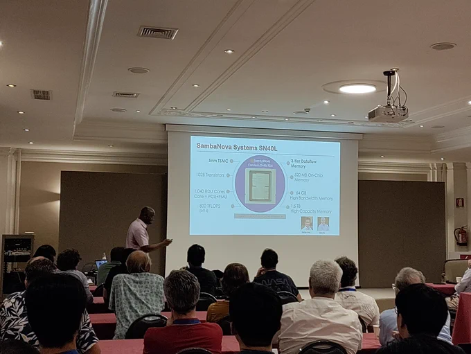 Kunle Olukotun giving keynote talk in front of slide at #ACACES24