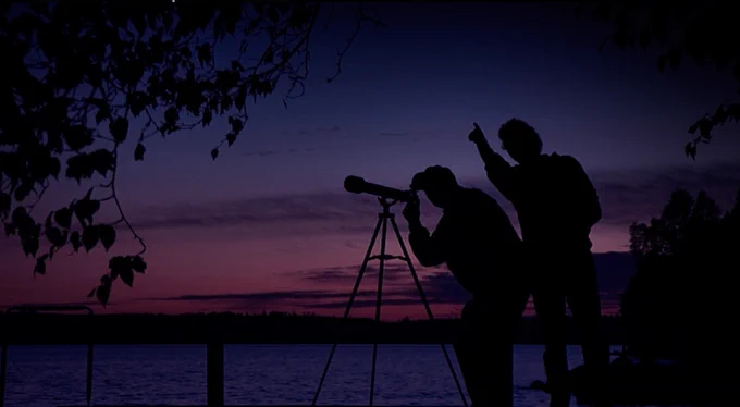 My grandfather and I using the same telescope we did when I was very young to find Venus at this cottage. This is a still image taken from footage from the documentary film @chasingatlantis
