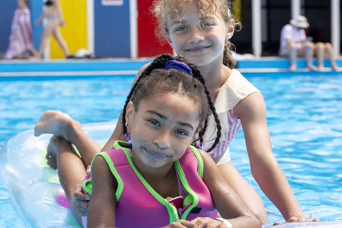 Children having fun at Lido in Tooting - which has daily free tickets on offer.