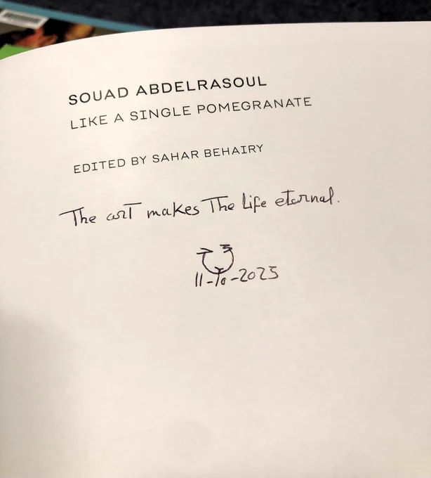 A picture of the title page of Souad Abdelrasoul's book Like a Pomegranate. Below the title reads 'Edited by Sahar Behairy'. Below this there is a handwritten inscription which reads "The art makes the life eternal" and below this the date "11-10-2023" is written.