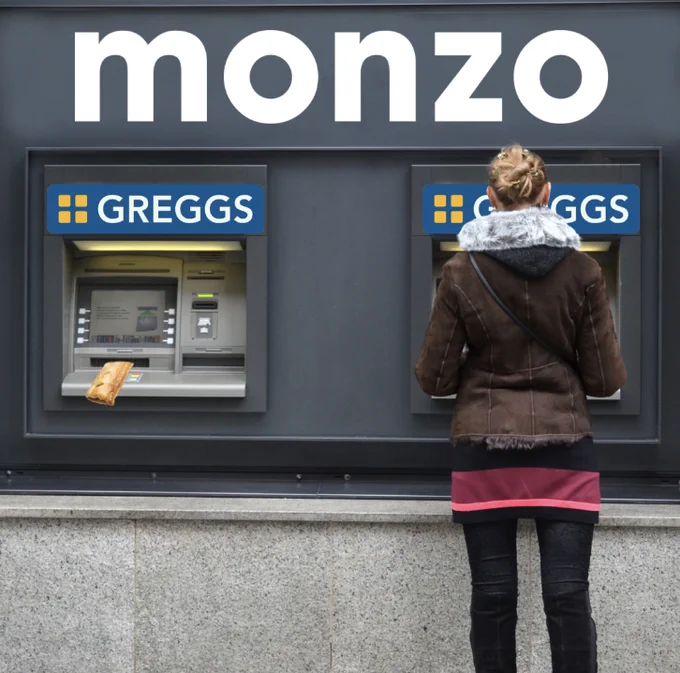 two cash machines side by side. There is a sign on the wall that says 'Monzo' and right above each cash point there's a Greggs logo. A woman is standing by one cash point, and at the other there's a sausage roll coming out the hole where normally cash would be dispensed. 