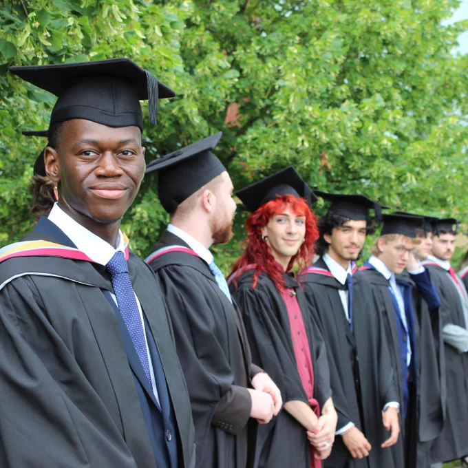 Graduating students line up for college photo
