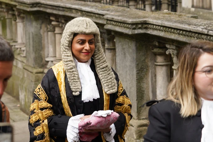 Close-up of Lord Chancellor Shabana Mahmood in her barrister's wig and black and gold ceremonial robe