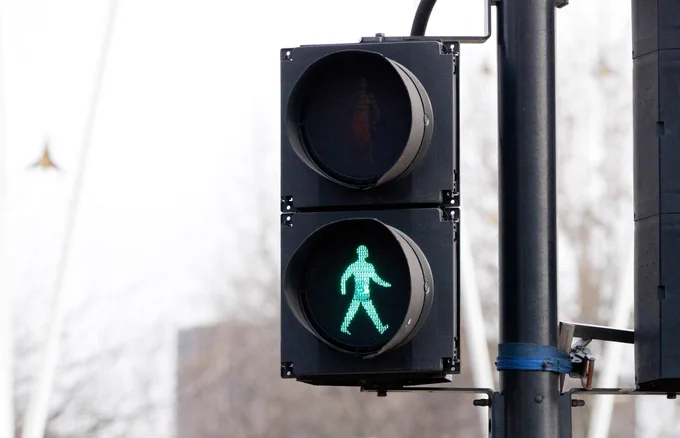 close up photo of a pedestrian signal in London.