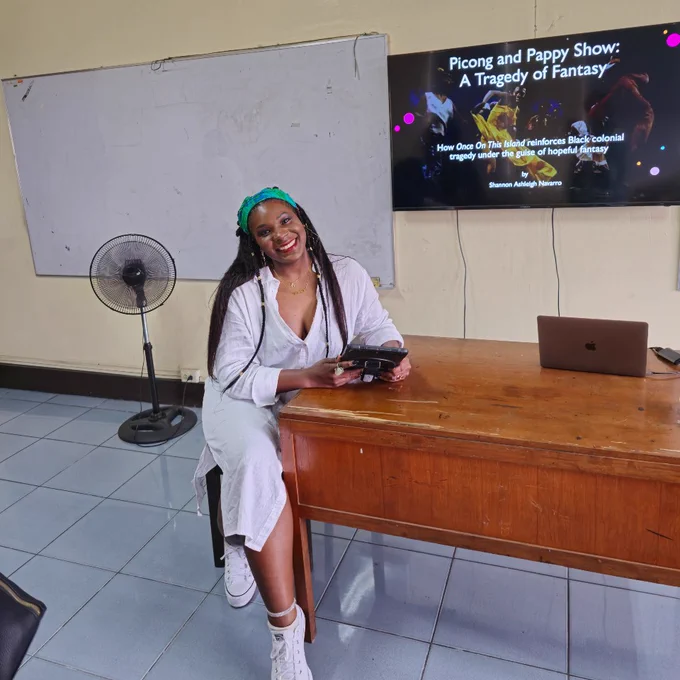 Shannon Navarro seated at a desk to present at the IFTR 2024 conference