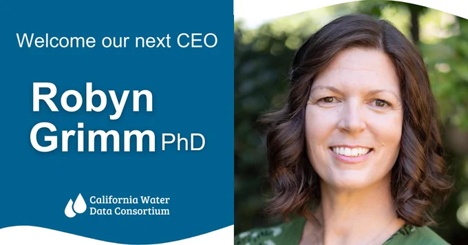 On the left: White text on a dark blue background with the words "Welcome our next CEO, Robyn Grimm, PhD" with the California Water Data Consortium logo beneath.

On the right: A smiling woman with brown hair wearing a green blouse against a background of greenery.