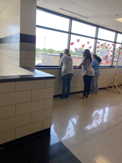Teachers collaborating while filming the weather to explain changes in weather patterns.