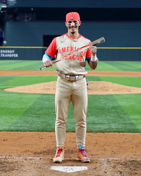 Jarren Duran smiles while holding the Ted Williams All-Star Game MVP trophy