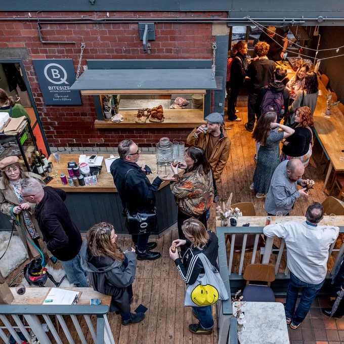 People drinking and eating in a cafe
