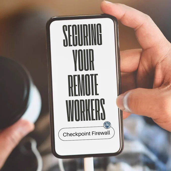 A close-up of a hand holding a smartphone that displays the text 'Securing Your Remote Workers' with the Esatec logo and 'Checkpoint Firewall' at the bottom. The background shows a blurred setting, suggesting a remote work environment.