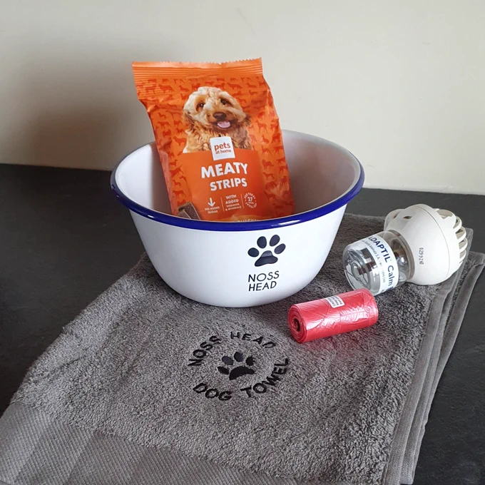 Dog treats, water bowl, dog towel, poo bags and calming plug in