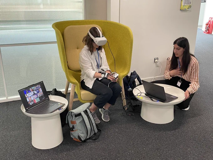 Photo of somebody trying out adapted technology at the inaugural Association for Computing Machinery Europe Summer School at the STEAMhouse building.