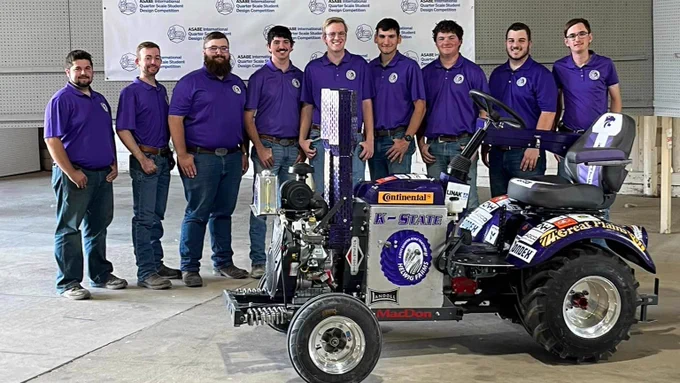 The team poses with the tractor.