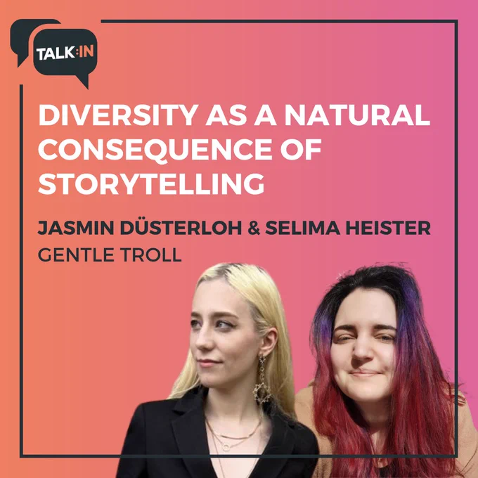Das Bild zeigt eine Ankündigung für einen Vortrag von Jasmin Düsterloh und Selima Heister von "Gentle Troll". Der Vortrag trägt den Titel "Diversity as a Natural Consequence of Storytelling". Die beiden Sprecherinnen sind unten im Bild abgebildet: Jasmin Düsterloh mit blonden Haaren und schwarzer Kleidung links, und Selima Heister mit dunklen, teilweise lila gefärbten Haaren und einem rosa Oberteil rechts. Der Hintergrund ist in einem Farbverlauf von orange zu pink gehalten. Oben links ist das Logo von "TALK:IN" zu sehen.