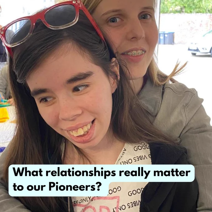 Young Pioneers Gracie and Mercades hugging and smiling. Text reads "What relationships really matter to our Pioneers?" 