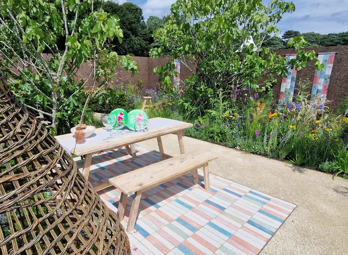 Photo of the picnic table with two awards 