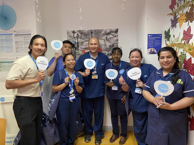 Photo of nurses standing for a team photo at Charing Cross Hospital.